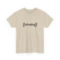 Beige t-shirt with 'still walking' text and footprints on a white background