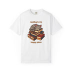 Cute cartoon cat sleeping on a stack of colorful books with the phrase ‘reading is my happy place’ in a cozy, whimsical design.