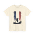 Beige t-shirt with a hiking silhouette design on a white background