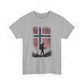 Gray t-shirt with a graphic of a person hiking in front of a cross and red pattern on a white background