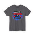 Gray t-shirt with colorful graphic and text 'Currently Pretending to Care' on a white background