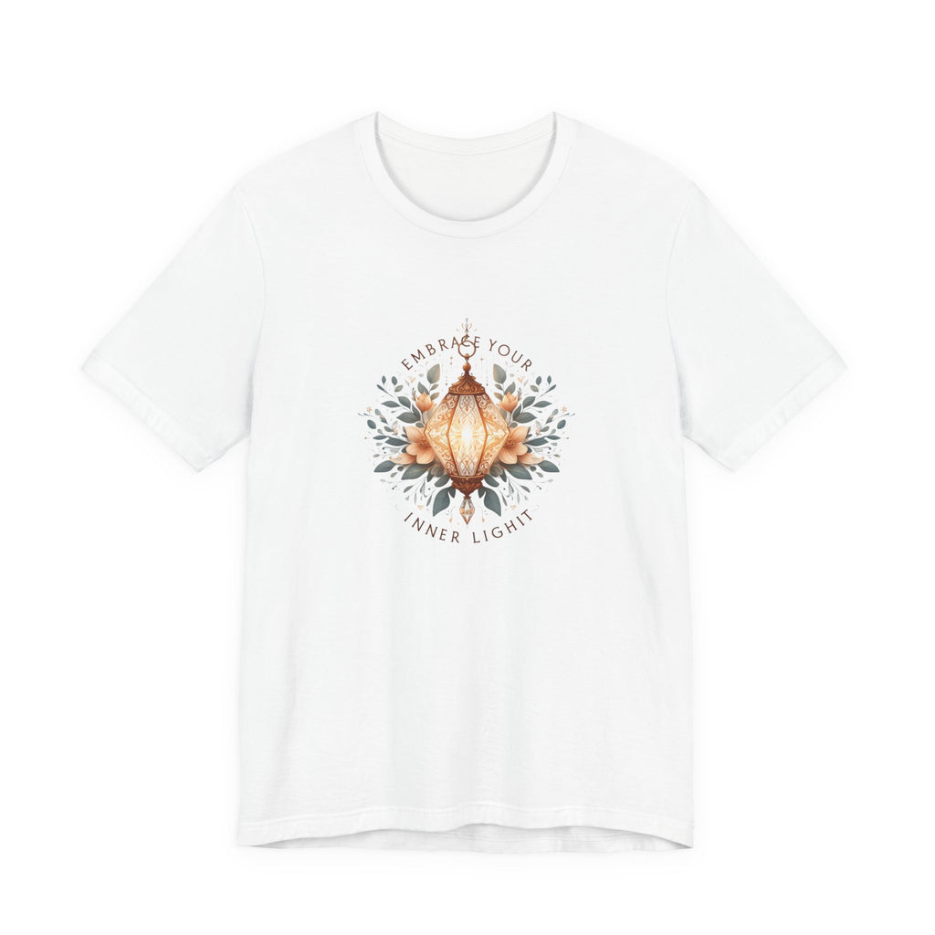 Ornate digital illustration of a glowing crystal-shaped hanging lantern framed by symmetrical floral design, with warm light details and quote text ‘Embrace your inner light’.