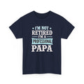 Navy blue t-shirt with white and light blue text on a white background, i'm not retired i'm a professional papa