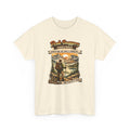 Beige t-shirt with a graphic of a hiker and mountain scene, featuring text 'Peak Baggers Anonymous'.