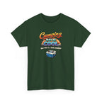 Green t-shirt with funny 'Camping may be cool, but this is a little cooler' graphic on a white background