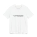 White t-shirt with humorous text on a white background