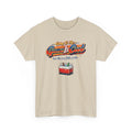 Beige t-shirt with funny text 'going to the game is cool but this is a little cooler' with a small cooler graphic