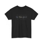 Black t-shirt with 'be the good' text on a white background